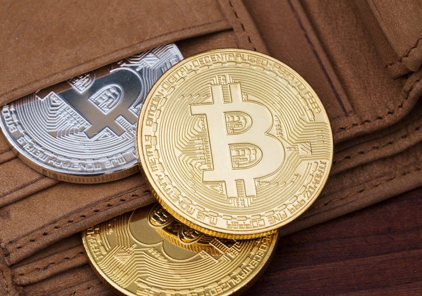 Bitcoin in leather wallet